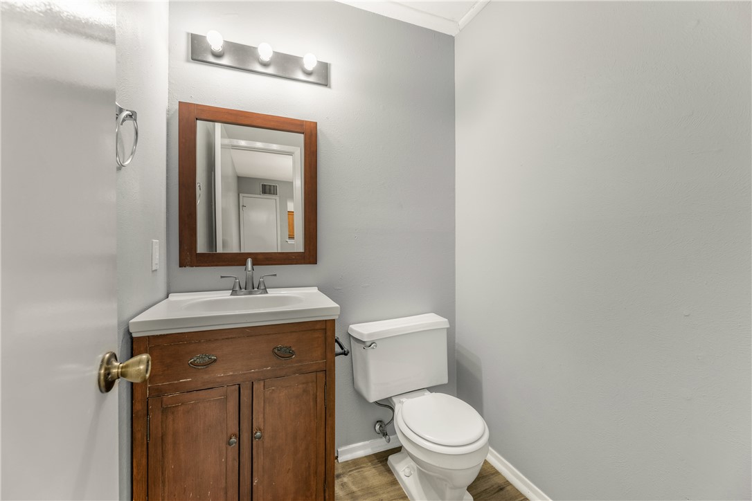 2101 Barak Lane, Unit 17 Bryan, TX 77802 - Photo 9 of 19 a bathroom with a toilet a sink and mirror