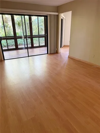 a view of an empty room with a window