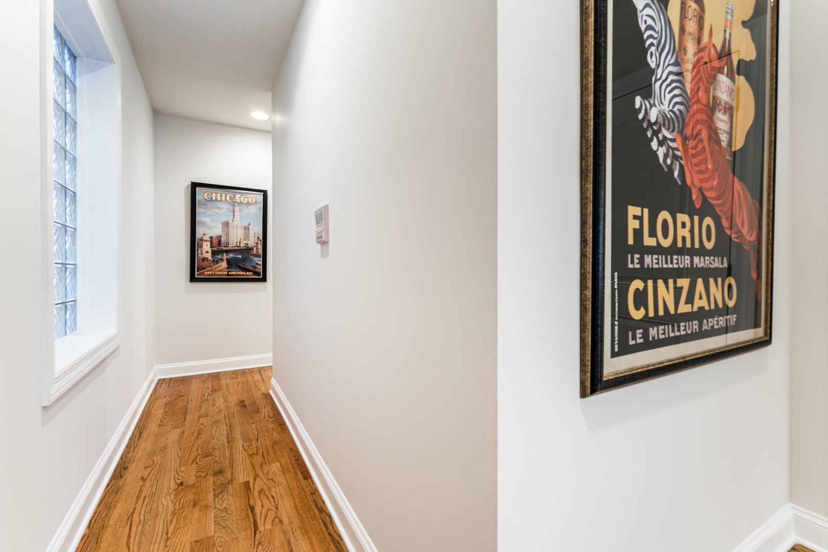 844 West Erie Street, Unit 1 Chicago, IL 60642 - Photo 15 of 37 a view of a hallway with wooden floor and a bathroom