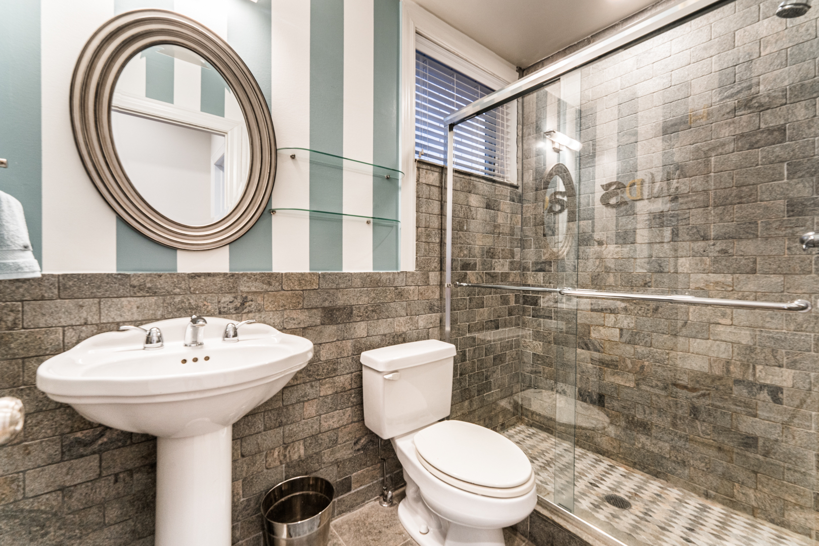 844 West Erie Street, Unit 1 Chicago, IL 60642 - Photo 26 of 37 a bathroom with a sink a toilet and a mirror