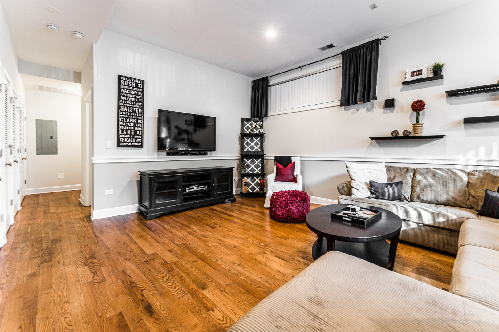 844 West Erie Street, Unit 1 Chicago, IL 60642 - Photo 28 of 37 a living room with furniture and a flat screen tv