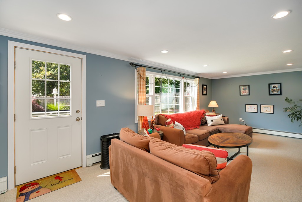 4 Beaconsfield Drive Natick, MA 01760 - Photo 11 of 22 a living room with furniture and a window