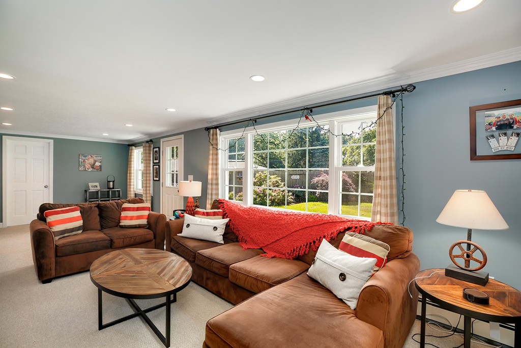 4 Beaconsfield Drive Natick, MA 01760 - Photo 12 of 22 a living room with furniture and a lamp