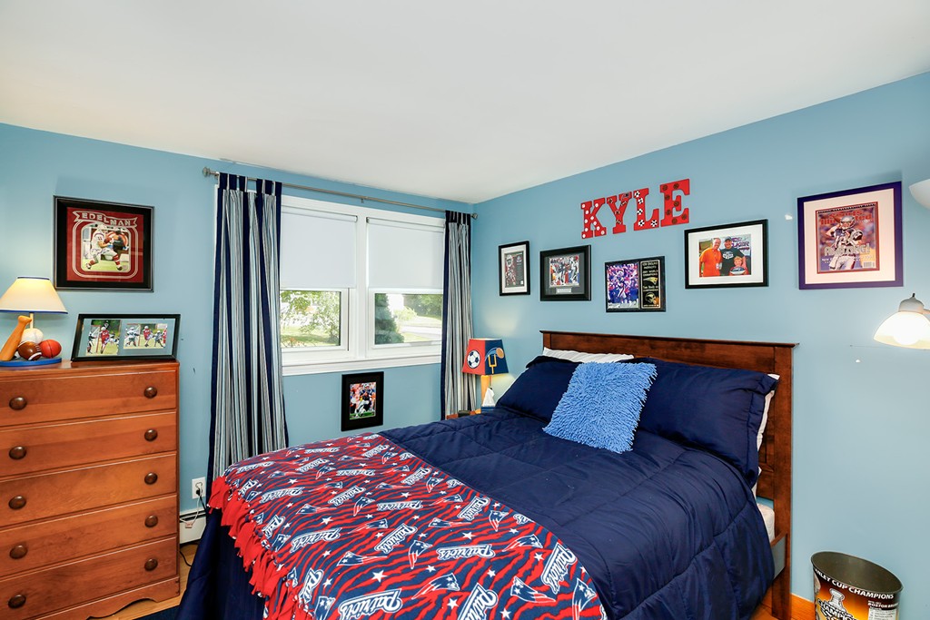 4 Beaconsfield Drive Natick, MA 01760 - Photo 19 of 22 a bedroom with a bed and a dresser in it