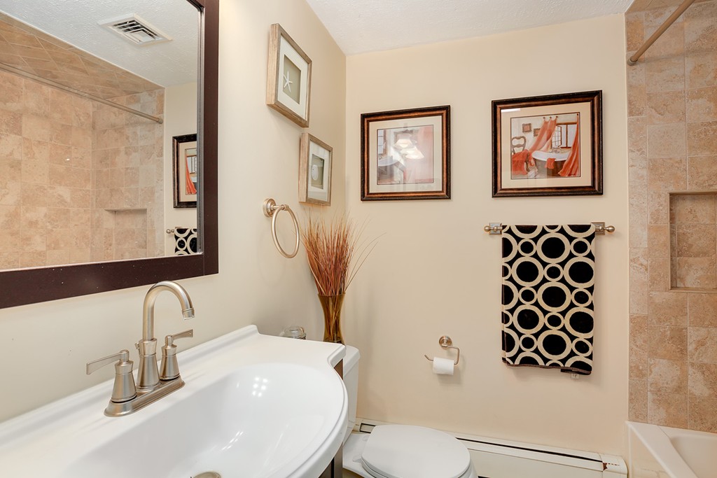 4 Beaconsfield Drive Natick, MA 01760 - Photo 20 of 22 a bathroom with a sink and a mirror