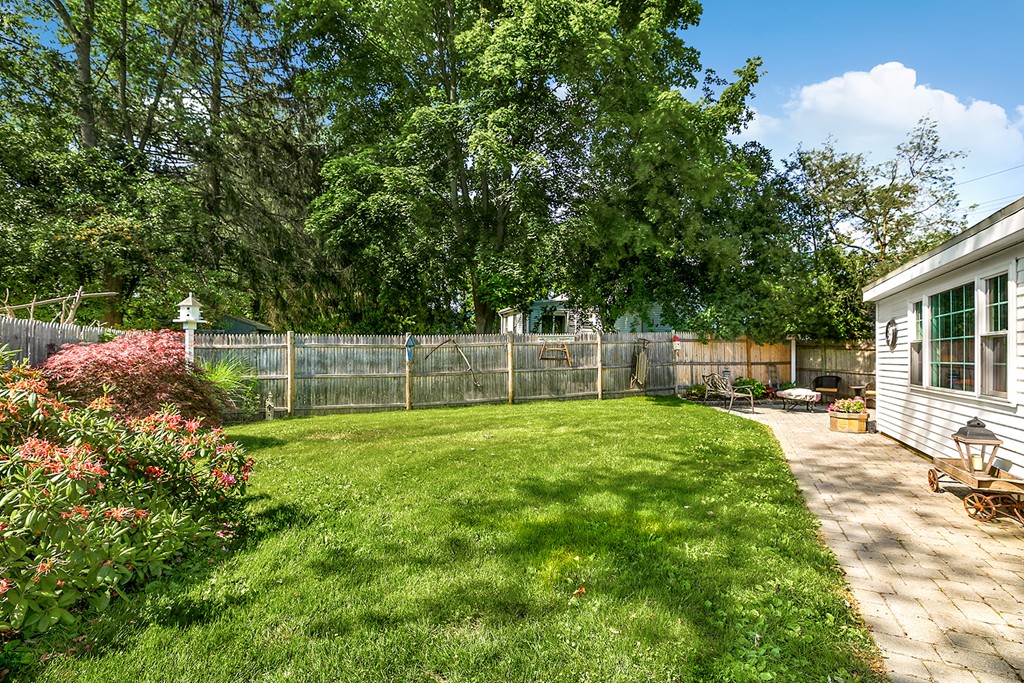 4 Beaconsfield Drive Natick, MA 01760 - Photo 21 of 22 a view of a backyard with furniture