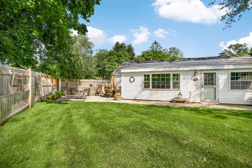 4 Beaconsfield Drive Natick, MA 01760 - Photo 22 of 22 a house view with a sitting space and garden