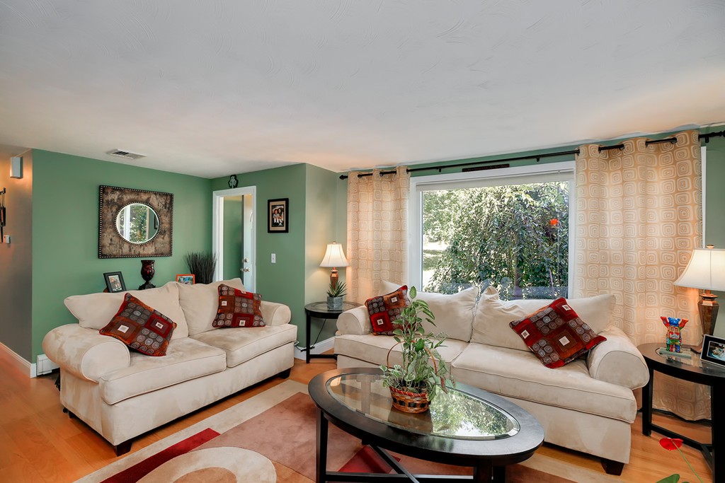 4 Beaconsfield Drive Natick, MA 01760 - Photo 4 of 22 a living room with furniture and a large window