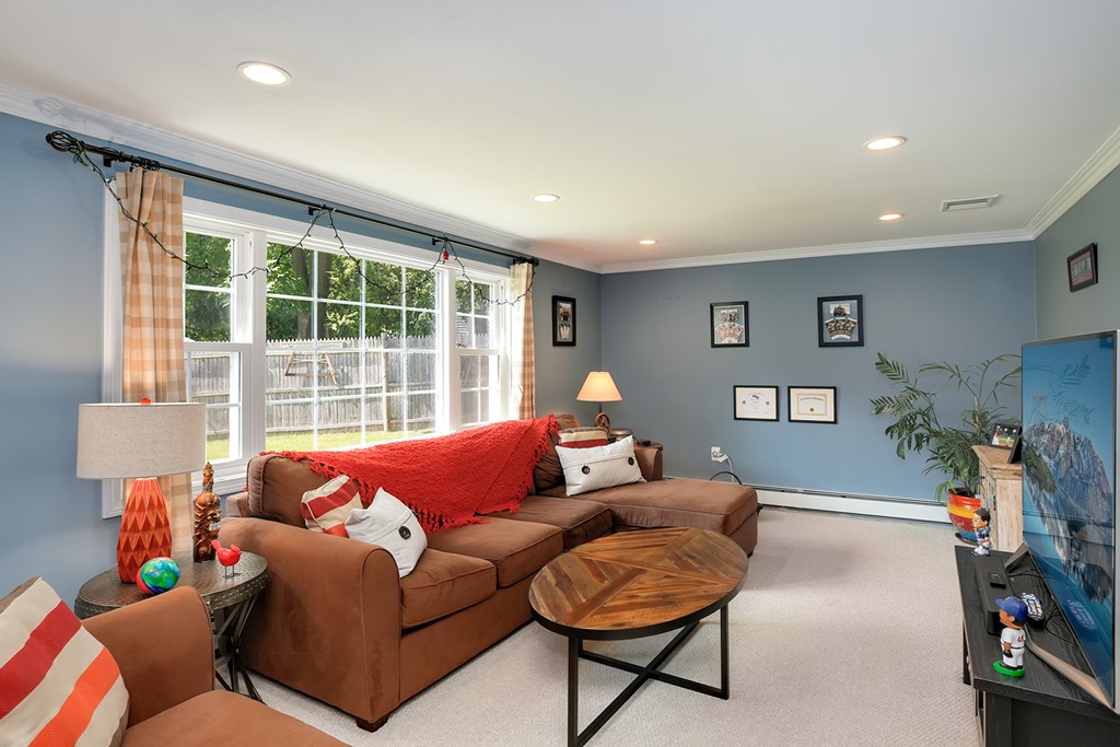 4 Beaconsfield Drive Natick, MA 01760 - Photo 10 of 22 a living room with furniture and a window