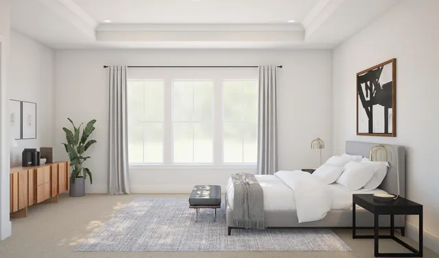 a spacious bedroom with a bed and glass window