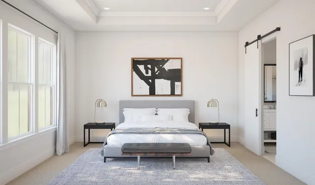 a bedroom with furniture and a window