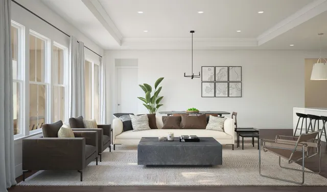 a living room with furniture ceiling fan and a window