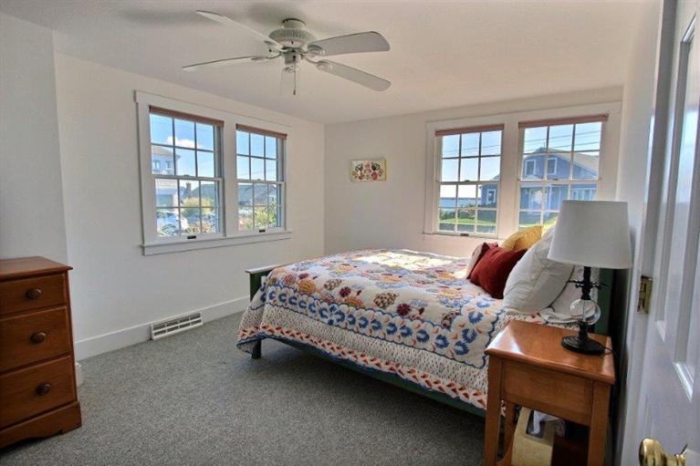 149 Leeward Road Bourne, MA 02532 - Photo 15 of 35 a bed room with a bed and a window
