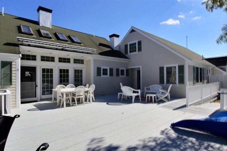 149 Leeward Road Bourne, MA 02532 - Photo 20 of 35 a front view of house with outdoor seating