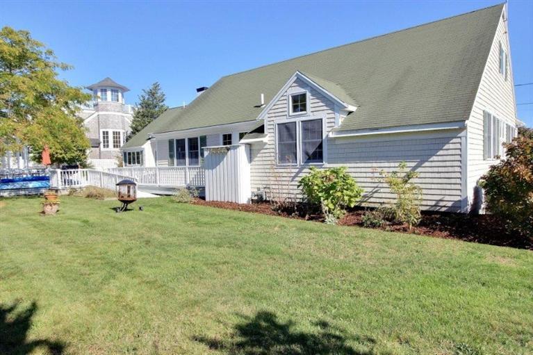149 Leeward Road Bourne, MA 02532 - Photo 22 of 35 a front view of a house with a yard