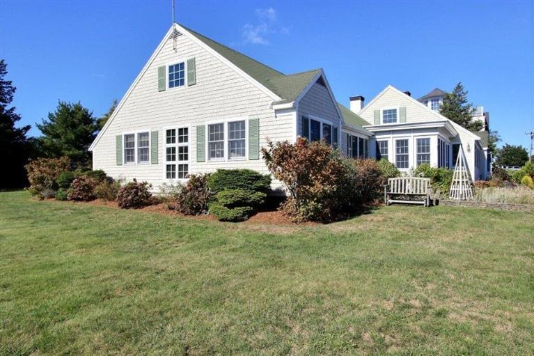 149 Leeward Road Bourne, MA 02532 - Photo 23 of 35 a front view of a house with a garden