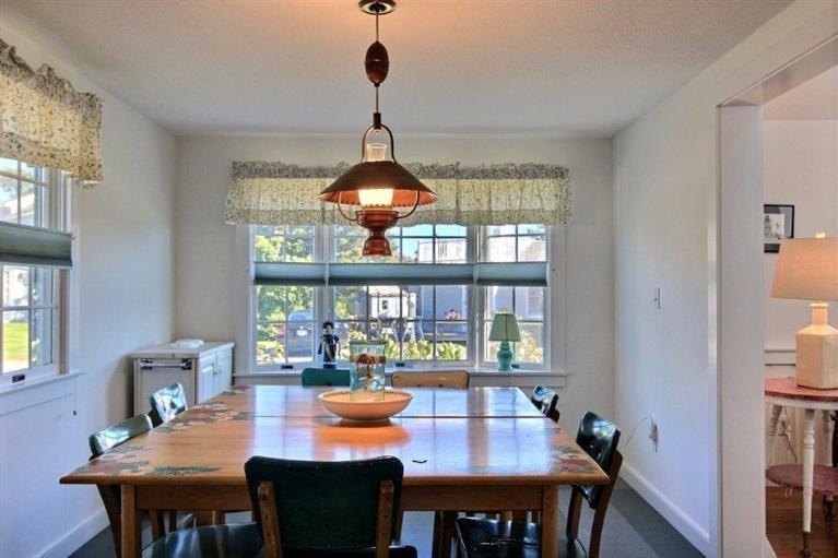 149 Leeward Road Bourne, MA 02532 - Photo 6 of 35 a dining room with furniture a chandelier and window
