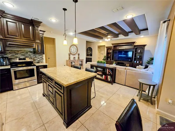 a kitchen with a stove and a microwave
