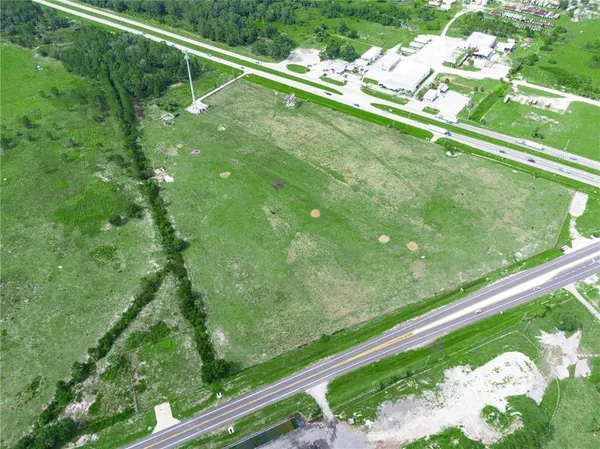 a view of a yard with pool and outdoor seating
