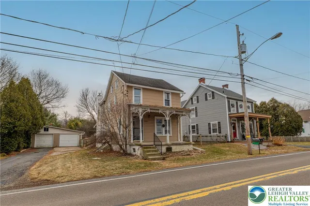 a front view of a house with a garage