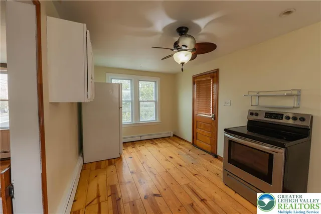 a kitchen with a stove and a microwave