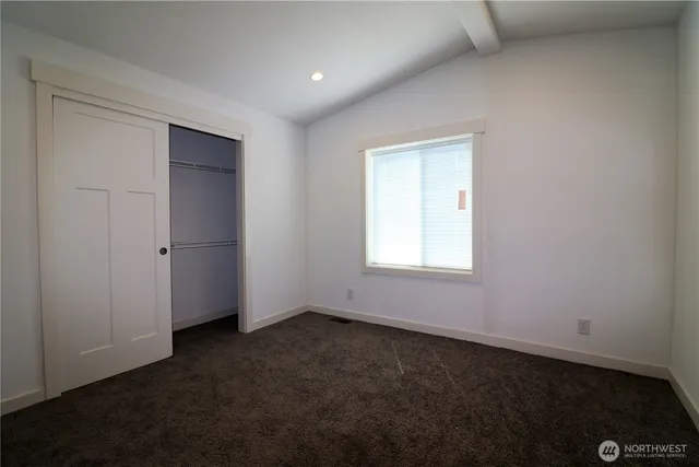 an empty room with a empty space and window