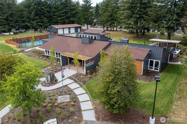 an aerial view of a house with a swimming pool