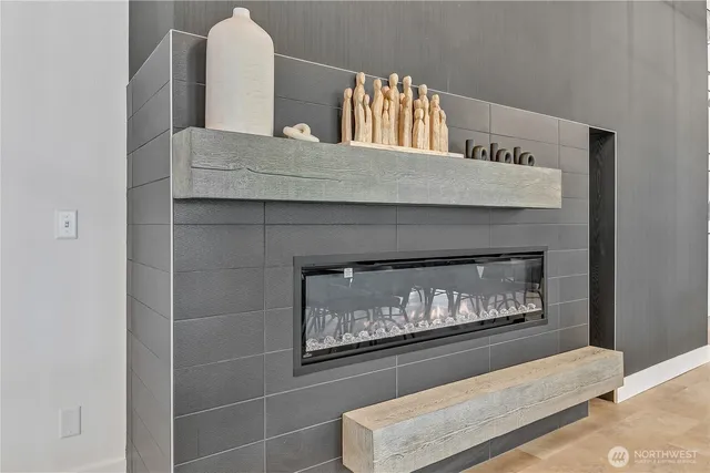 a living room with furniture a table and wooden floor