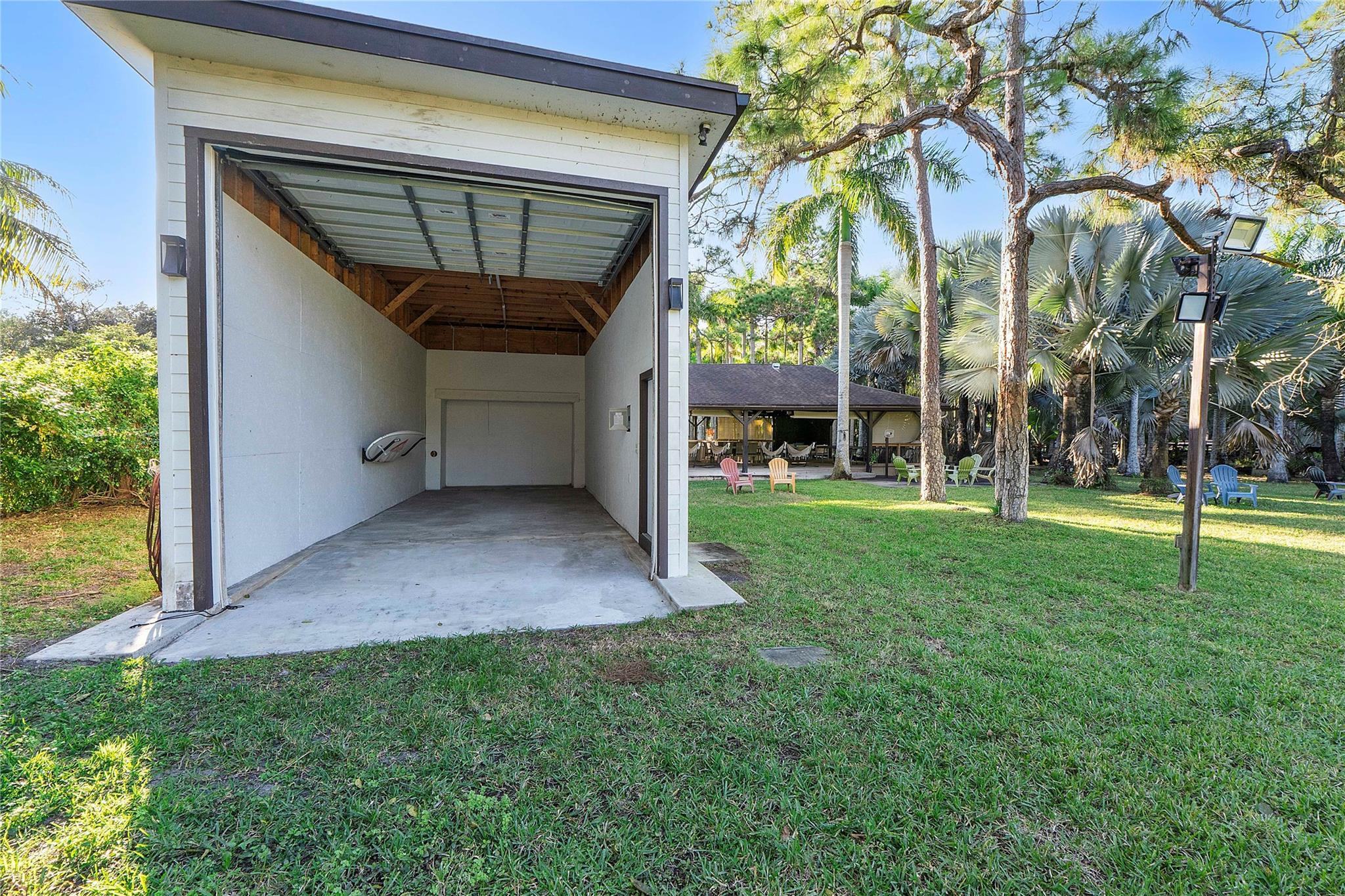 5351 Godfrey Road Parkland, FL 33067 - Photo 89 of 95 a view of a house with a yard