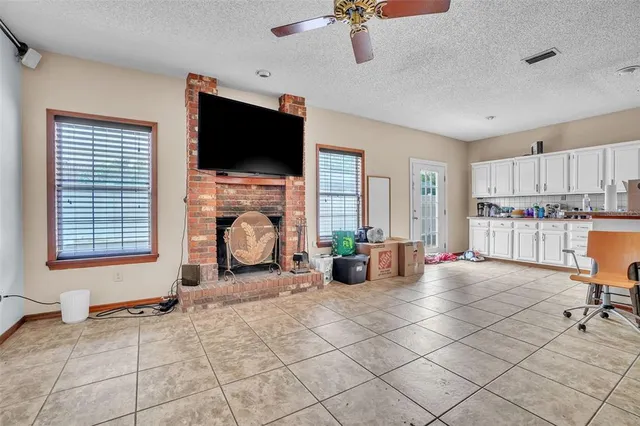 a view of a livingroom with furniture and a flat screen tv