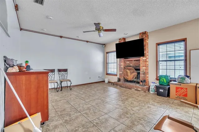 a view of a livingroom with furniture and a flat screen tv