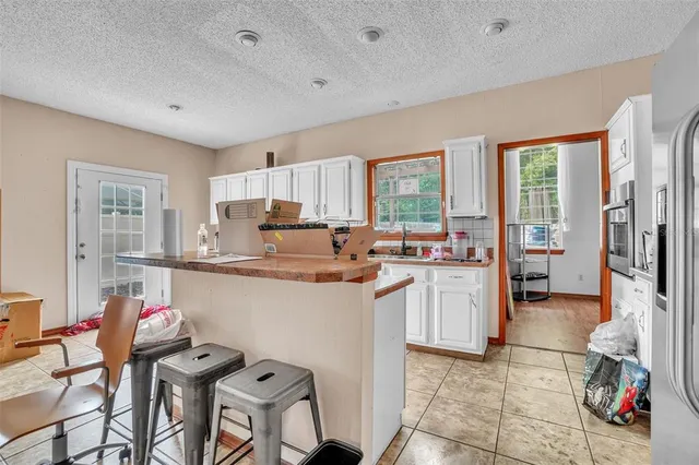 a kitchen with counter top space and appliances