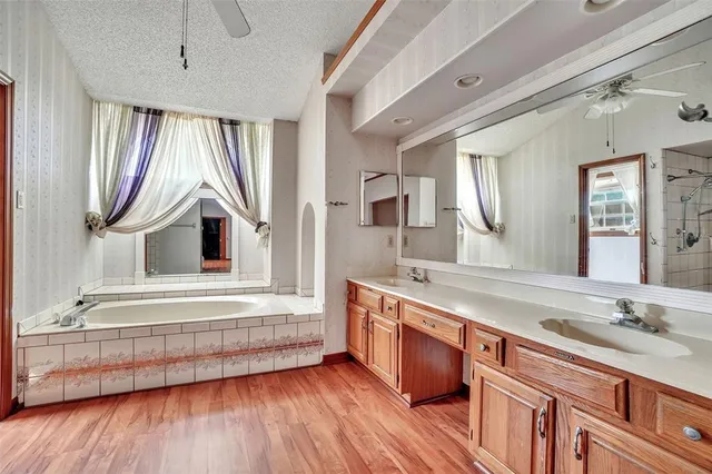 a bathroom with a shower and a glass door