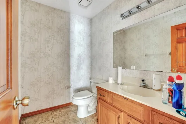 a bathroom with a tub a sink and a window