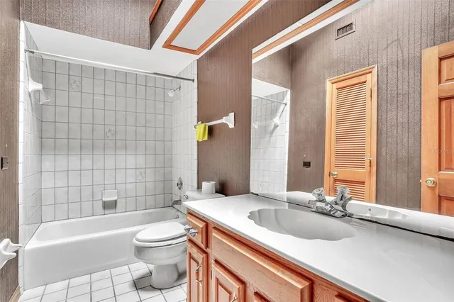 a bedroom with furniture and a wooden floor