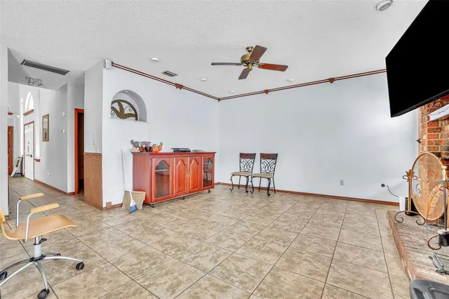 a view of a livingroom with furniture and a flat screen tv