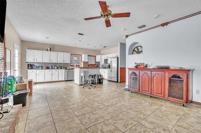 a room with lots of furniture and white walls