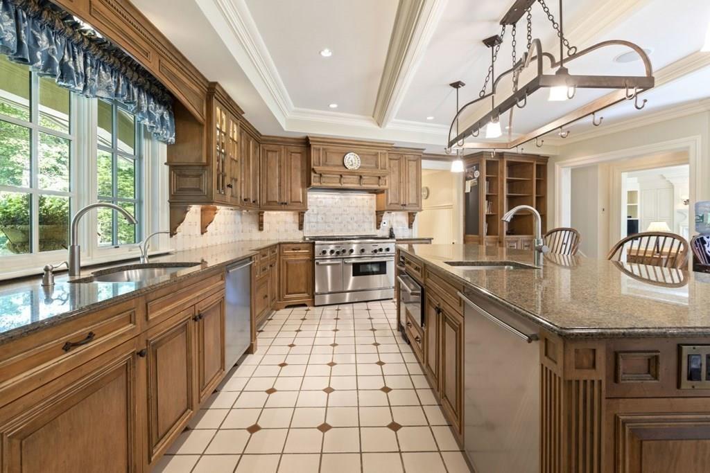 17 Clark Road Wellesley, MA 02481 - Photo 12 of 42 a large kitchen with stainless steel appliances granite countertop a sink and counter space