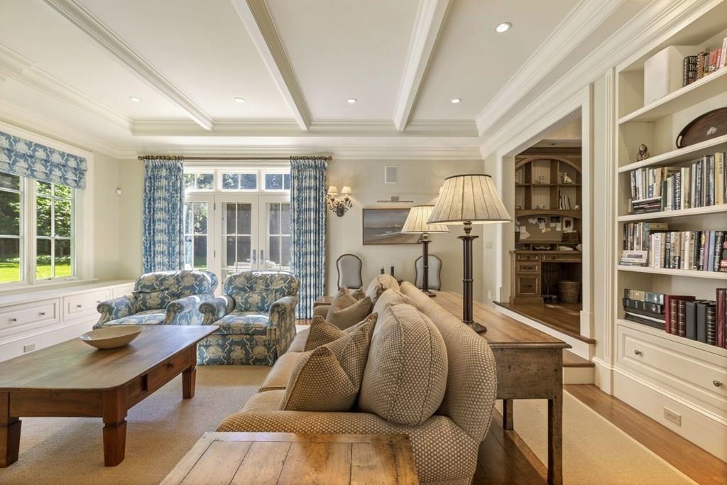 17 Clark Road Wellesley, MA 02481 - Photo 17 of 42 a living room with furniture fireplace and book shelf