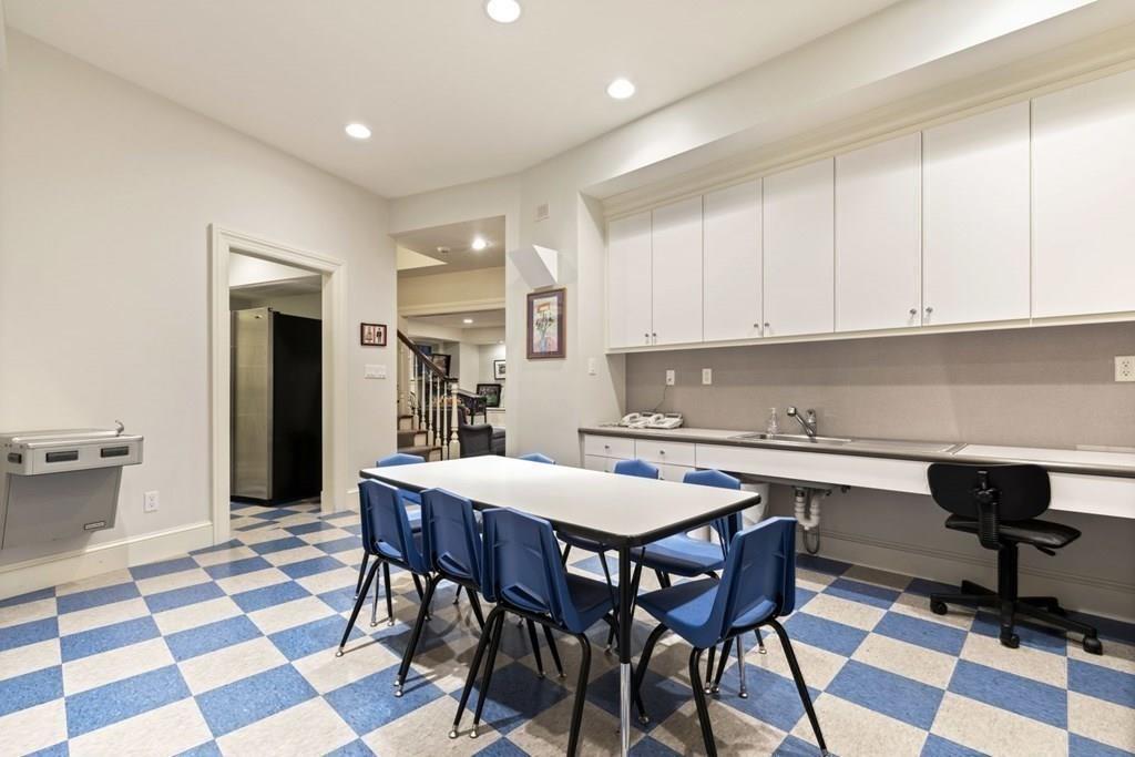 17 Clark Road Wellesley, MA 02481 - Photo 30 of 42 a view of a dining room with a table and chairs