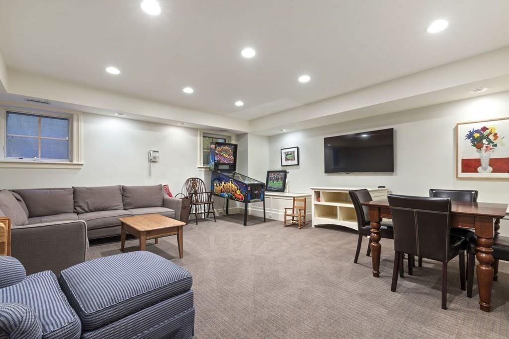 17 Clark Road Wellesley, MA 02481 - Photo 31 of 42 a living room with furniture and a flat screen tv