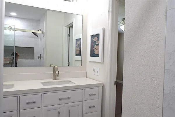 a close view of a sink and cabinets in the kitchen