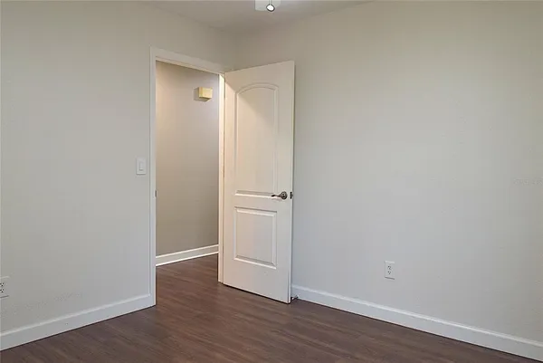 a bathroom with a granite countertop toilet a sink and bathtub