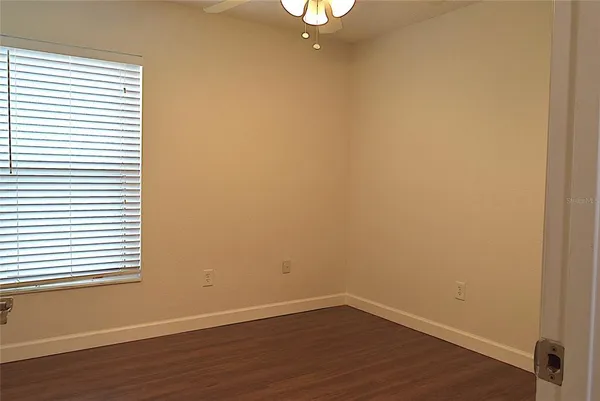 a view of front door with wooden floor