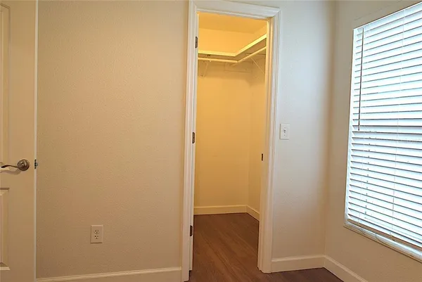 an empty room with wooden floor