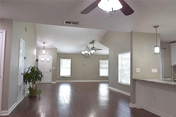a view of an entryway with wooden floor