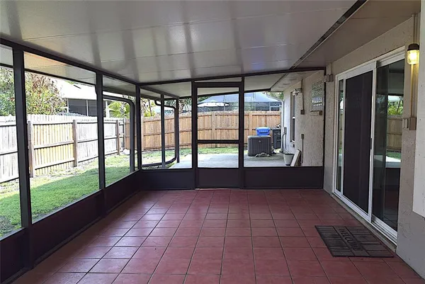a view of empty room with windows