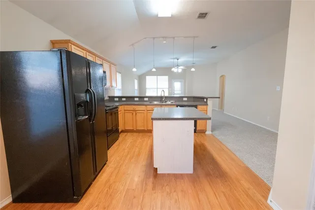 an empty room with a view of a house