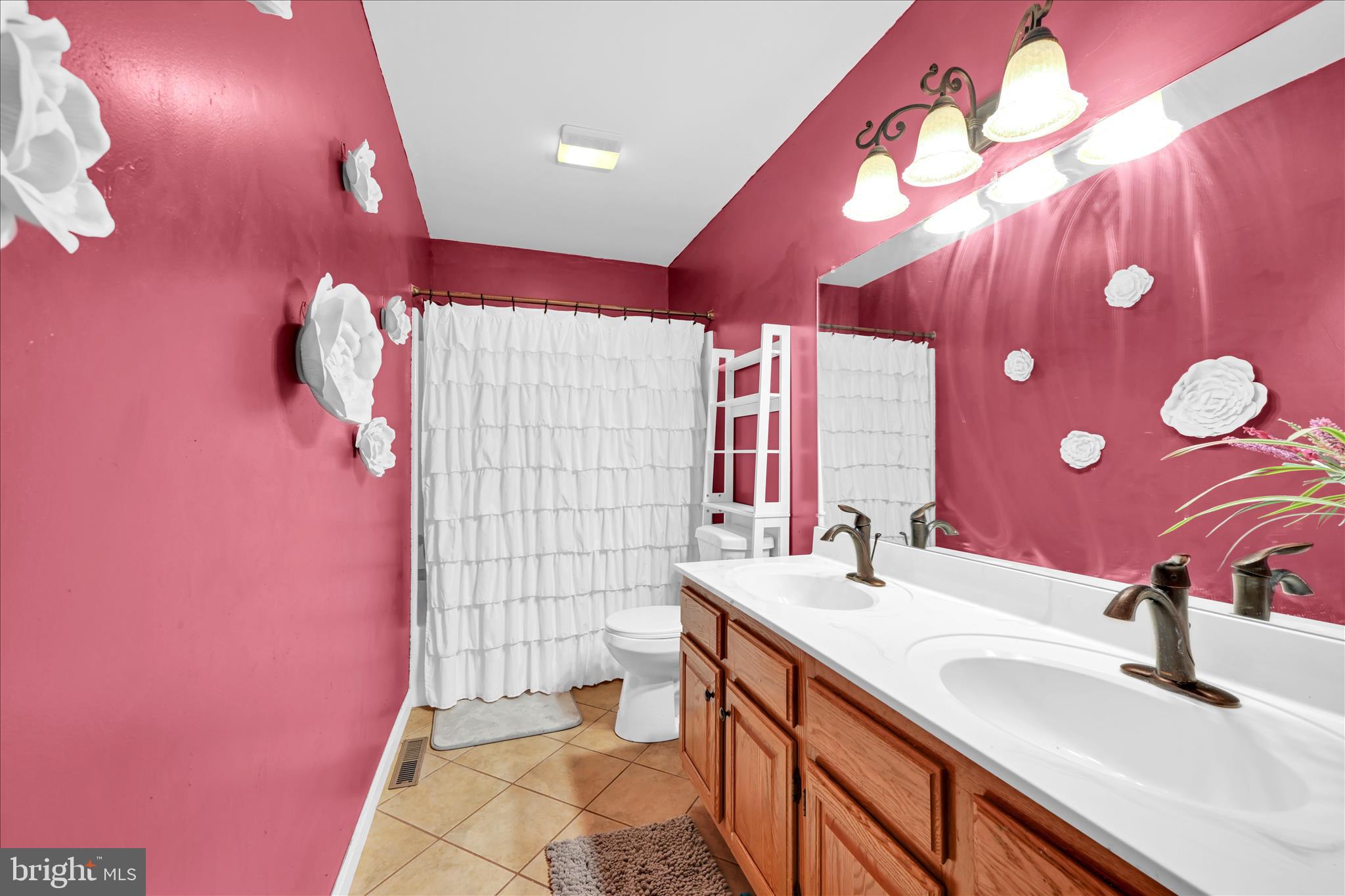 1602 Churchill Road Harrisburg, PA 17111 - Photo 34 of 61 a bathroom with a sink vanity and a mirror