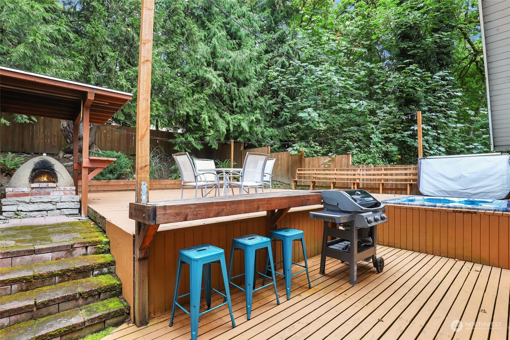 14630 200th Avenue Southeast Renton, WA 98059 - Photo 26 of 40 a view of a chairs and table on the deck